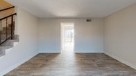 Located at 228 Sanders Ferry Rd in Hendersonville, Tennessee, this two-floor residence offers a well-organized layout with thoughtfully updated interiors throughout. The living areas feature durable wood-look flooring in neutral tones, contributing to a clean and cohesive aesthetic. Natural light filters in through window blinds, brightening the open, neutral-walled rooms and creating an airy atmosphere.

The kitchen is a functional galley-style space equipped with dark cabinetry, marble-look countertops, a white subway tile backsplash, and black appliances including a refrigerator, electric range with overhead ventilation, and dishwasher. The wood-look flooring continues seamlessly throughout this area.

The bedrooms are carpeted for comfort and feature textured ceilings, neutral walls, and ample natural light from windows. Select bedrooms include built-in closets with bifold doors, providing practical storage solutions.

The bathroom is finished with a dark vanity cabinet, a marble-look countertop, a large mirror, and a tiled tub-shower combination, offering a clean and updated look.

Throughout the space, consistent design choices—including textured ceilings, white trim, and a neutral color palette—create a unified and move-in ready environment suitable for a variety of lifestyles.