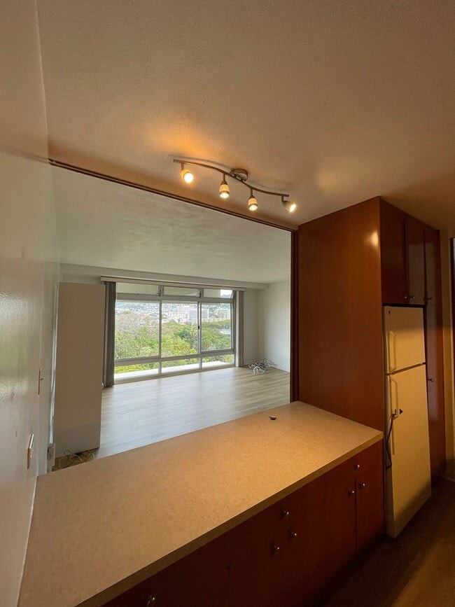 Building Photo - 11th Floor, Queen Emma Garden Unit with Upgrades and Downtown and Mountain Views.