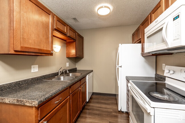 2BR, 1BA - 675 SF - Kitchen - Adventureland Village Apartments