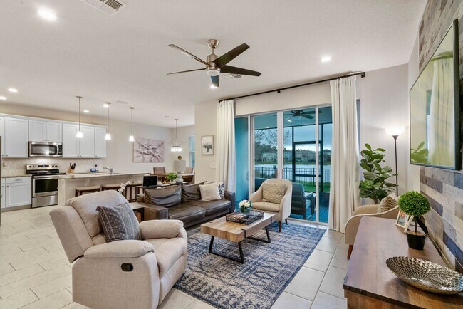 Building Photo - Water Front Home- 4 Large Bedrooms-3 baths Gated Community Call Sheila Campbell 407-687-7900