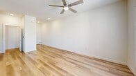 Located in Corinth, TX, this two-story home offers a thoughtfully designed layout spread across two floors. The ground floor houses the main living areas, including an open kitchen and living room combination finished with light hardwood-style flooring and a ceiling fan. The kitchen is a standout space, featuring gray shaker-style cabinetry, granite countertops, a herringbone tile backsplash, and a full suite of stainless steel appliances including a range, microwave, and refrigerator. An attached garage with an automatic opener, electrical panel access, and interior entry door provides added convenience on this level.

The upper floor, which comprises the majority of the home's total footprint, accommodates three bedrooms, three bathrooms, and a dedicated laundry room. The bedrooms feature neutral carpet, ceiling fans, and ample closet space, with at least one bedroom offering glass French doors leading to an outdoor balcony. The bathrooms are finished with granite vanity tops, light hardwood-style flooring, and tile-surround tub-shower combinations or glass-enclosed walk-in showers. The laundry room includes side-by-side washer and dryer units. Throughout, the home maintains a clean, modern aesthetic with neutral tones and consistent finishes.