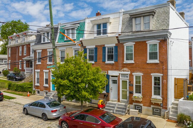 Manayunk row homes borrow Victorian architecture with Intricate ornamentation.