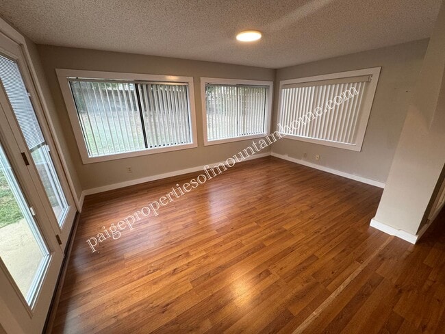 Building Photo - Charming 3 Bedroom, 2 Bath Home with Sunroom, Garage & Privacy-Fenced Yard