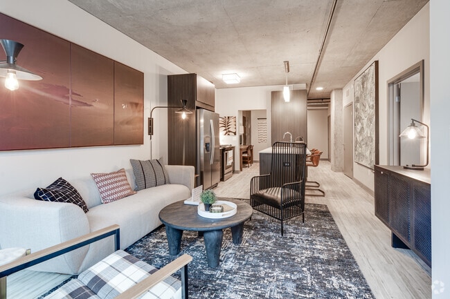 1BR, 1BA + Den - 870SF - Living Room - Nordhaus Apartment Homes