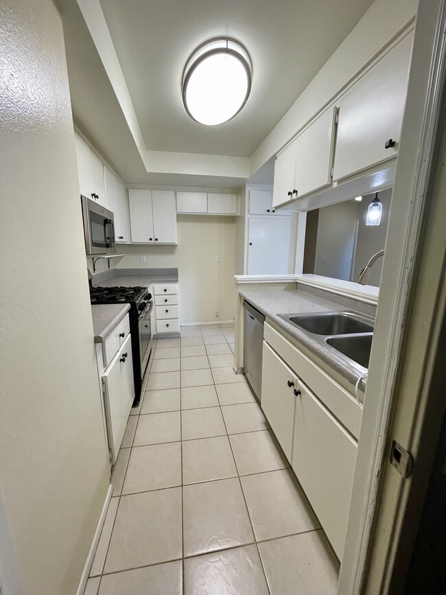 Kitchen entering from attached garage - 3706 W Park Central Ave