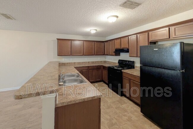 Foto del edificio - 5489 Village Pond Ct