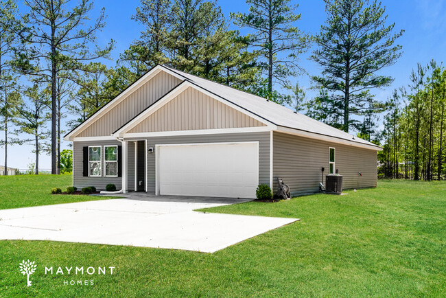 Building Photo - 4-Bedroom Home with Modern Features in Mac...