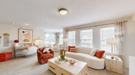 This well-designed one-bedroom, one-bathroom residence on Caravel Dr in Oklahoma City, OK offers a thoughtfully organized single-floor layout that maximizes every square foot. The living room is a standout space, featuring plush neutral carpeting, multiple large windows that flood the room with natural light, and views of the surrounding neighborhood. A pass-through bar connects the living area to the kitchen, creating an open, connected feel. Two bar stools at the counter make it an ideal casual dining or entertaining spot.

The kitchen is outfitted with crisp white shaker cabinetry, marble-style countertops, a classic tile backsplash, and stainless steel appliances including a range and over-the-range microwave, providing both style and functionality.

The bedroom is a comfortable, carpeted retreat with a ceiling fan, natural light from a window with soft drapery, and ample space for furnishings. It connects to the bathroom, which features a wide vanity with marble-style countertops, white cabinetry with brushed hardware, tile flooring, and built-in shelving for storage. A hallway ties all spaces together, contributing to the home's efficient and cohesive flow throughout.