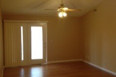 living room with patio door - 7313 Chatham Ct