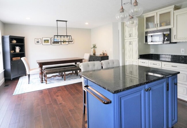 Kitchen island open to dining room - 7211 Ivy Way