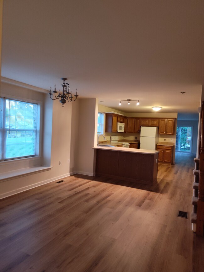 Kithcen and dining room with deep silled window in the dining area. - 3288 North St