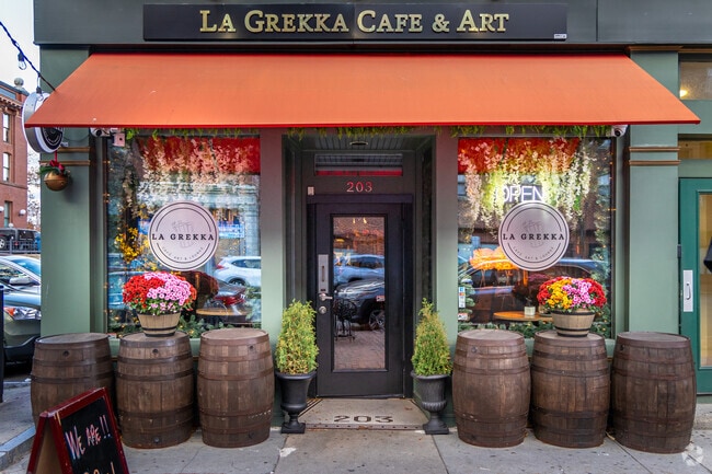 The entrance of La Grekka Café Art & Lounge is a local cafe in Lawrence, MA.