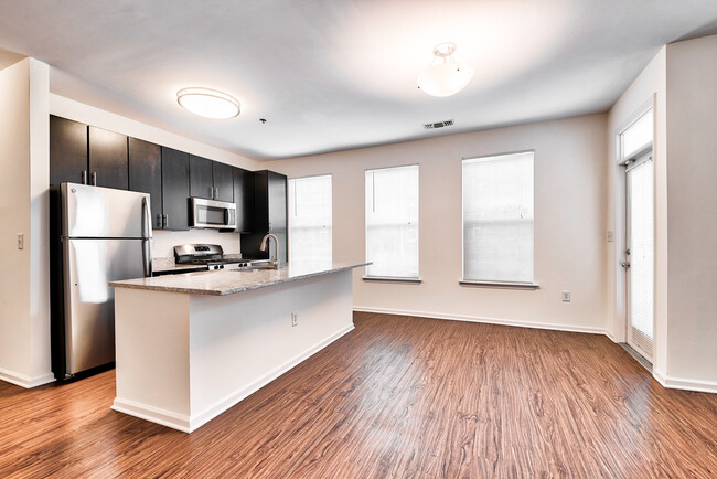 Open-Concept Floor Plans with luxury black walnut vinyl flooring - Windsor at Liberty House