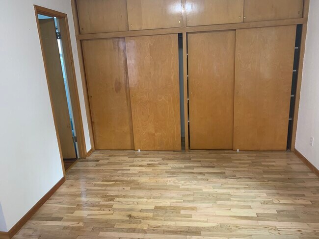 Bedroom with hardwood flooring - 1709 Lake Park Dr SW