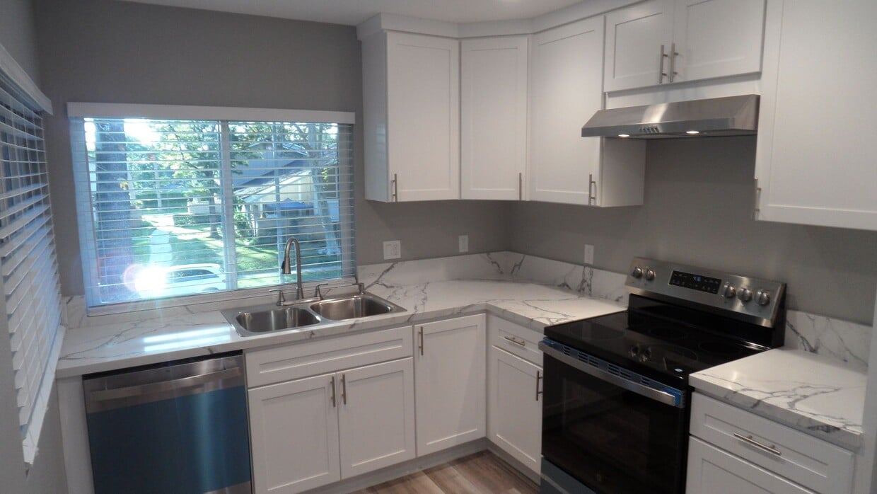 Primary Photo - REMODELED 2BR; 1BA end unit condo w/ 1 car garage & 1 parking space