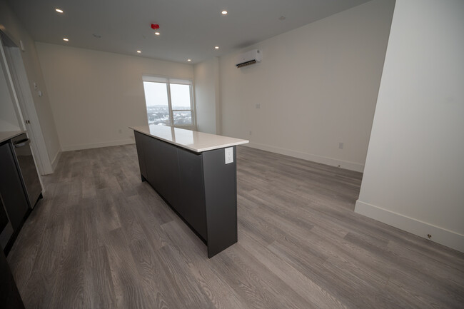 Building Photo - Beautiful New 1 Bed + Den