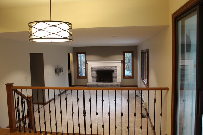 Open layout with the kitchen overlooking the adjacent living area for easy entertaining. - 6235 Sunnywood Dr