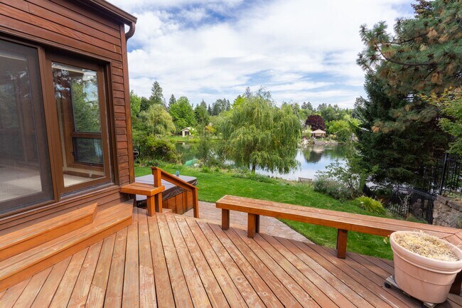 Building Photo - Private river access and stunning views from this home on Harmon Blvd! + Bonus Room