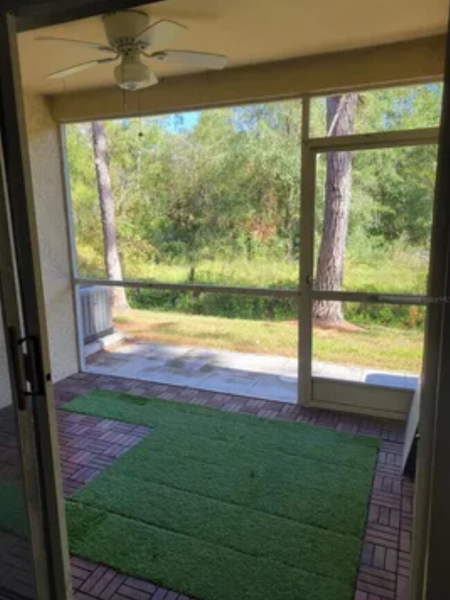 Nice patio to have some plants, por take a drink in the morning looking at the forest behind the uni - 8661 Hunters Key Cir