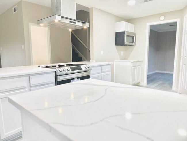 New kitchen with waterfall island - 1542 Glenmore Dr