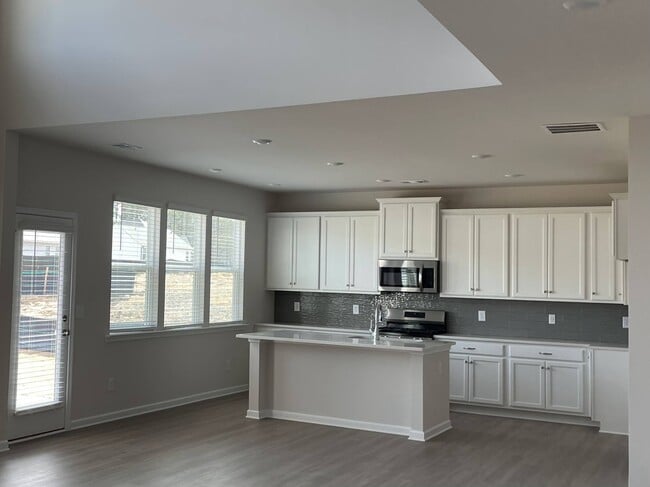 Open Kitchen with Island and Breakfast Area - 246 River Run Dr