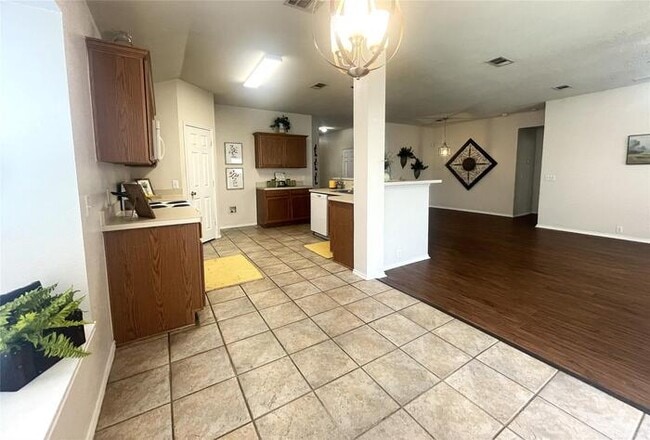 Building Photo - Plank Floors & Modern Comforts!" "Corner Fireplace, Split Bedrooms & a Master Retreat You’ll Love!"