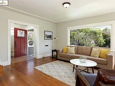 Large living room with picture frame window - 5451 Brookdale Ave