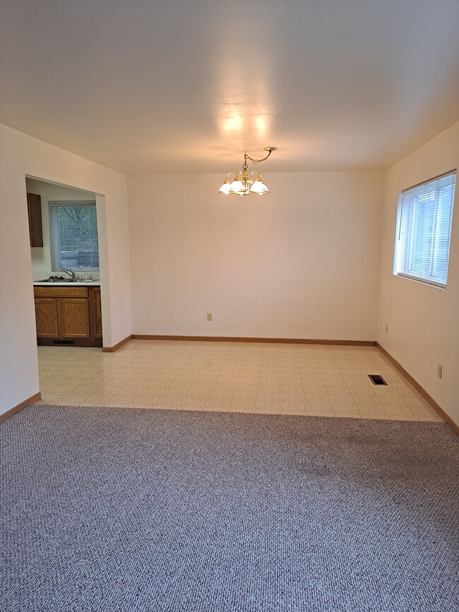 Large, airy windows open to the front for your dining area and living room. - 5727 W Barton St