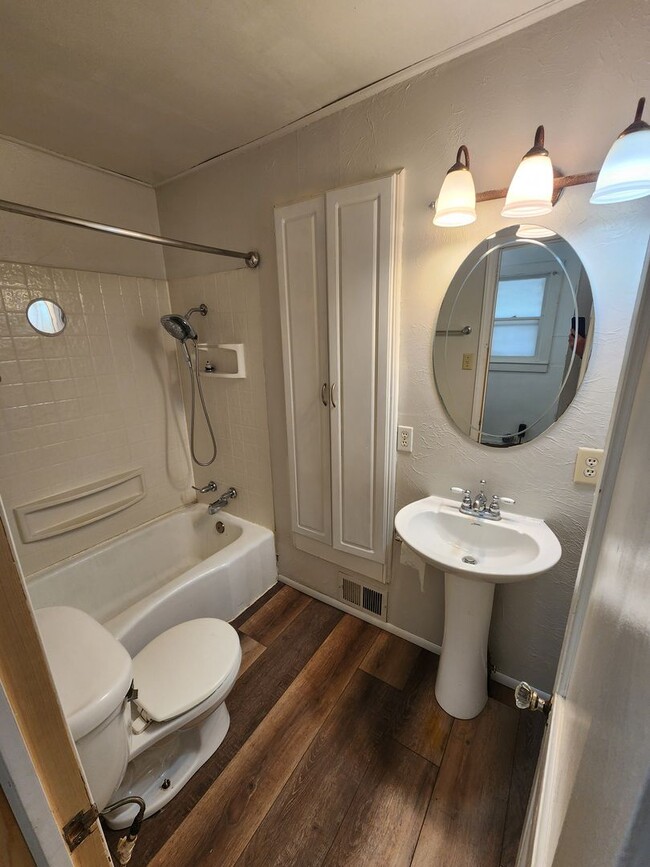 Building Photo - Nice home with oversized 2car gar with work bench and large shaded yard. Country-like setting