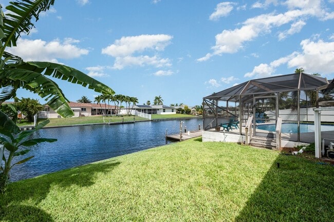Building Photo - Enjoy the pool or fish/kayak/boat from the...