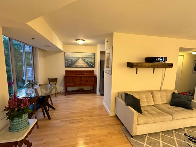 dining area and partial view of living room - 7500 Woodmont Ave