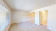 Located at 1511 S Novato Blvd in Novato, California, this single-floor, one-bedroom, one-bathroom residence offers a practical and well-organized layout. Throughout the living areas, soft wall-to-wall carpeting and neutral cream-toned walls create a clean, understated aesthetic complemented by textured ceilings.

The living room provides a comfortable, open feel with a front entry door and a window fitted with blinds that invite natural light and offer views of the surrounding mature trees. The space flows naturally toward a hallway connecting the key areas of the home.

The bedroom is a generously sized private retreat featuring sliding mirrored closet doors that provide ample built-in storage with both shelving and a hanging rod. A window frames a pleasant view of the tree-lined outdoor surroundings.

The kitchen is efficiently designed with white cabinetry, light countertops, a stainless steel sink, and a coil-burner electric range with an overhead vent — all set on easy-care tile flooring.

The bathroom is clean and functional, featuring tile flooring, a vanity with under-sink storage, a mirror cabinet, and a bathtub-shower combination.

A private outdoor deck extends the living space outward, overlooking a lush, tree-filled neighborhood setting — a tranquil touch that enhances the overall appeal of this Novato residence.