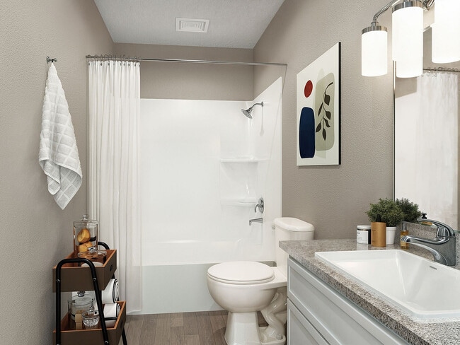 Bright bathroom with granite counters and bathtub - Vetra Hurstbourne