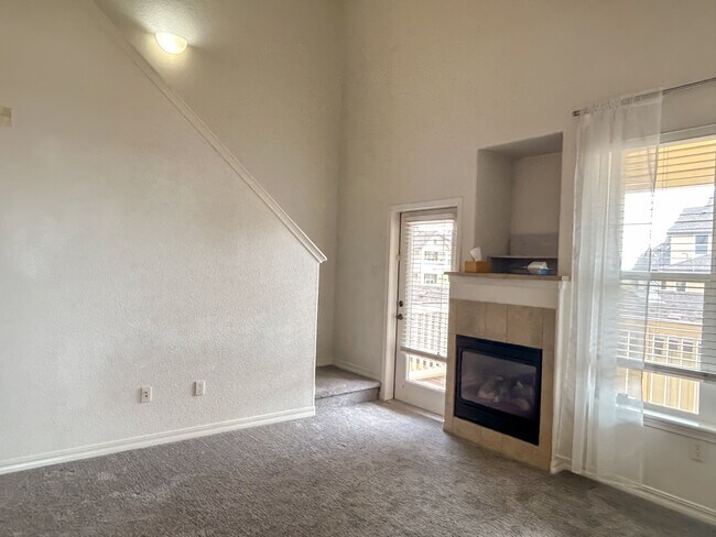 Living room and fireplace - 5378 Palomino Ranch Pt