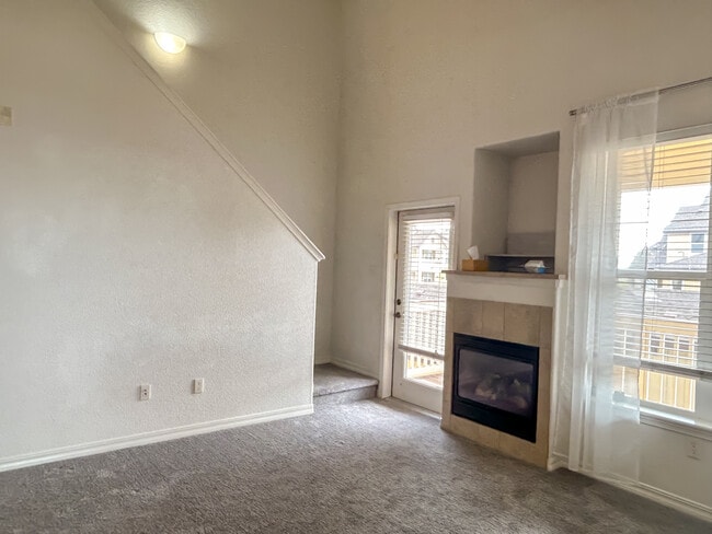 Living room and fireplace - 5378 Palomino Ranch Pt