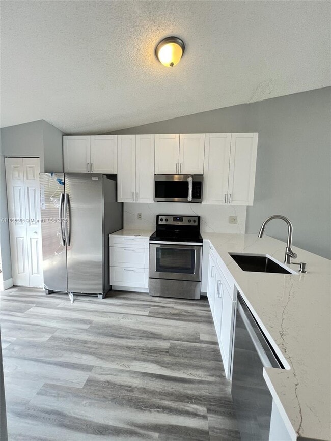Building Photo - 10155 Boca Bend E