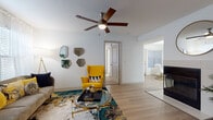 Located at 1658 S Hiawassee Rd in Orlando, Florida, this single-floor residence offers a thoughtfully designed layout with modern finishes throughout. The living area is bright and welcoming, featuring light wood-style flooring, a ceiling fan with integrated lighting, and large windows fitted with blinds that allow natural light to fill the space. The kitchen is well-equipped with stainless steel appliances, including a refrigerator, range, and microwave, complemented by white upper cabinetry, gray lower cabinetry, a white quartz countertop, and a peninsula with bar seating — ideal for casual dining or entertaining. Adjacent to the kitchen, the dining area accommodates a round table and is brightened by a window with natural light. The bedrooms feature plush carpeting, generous windows with sheer curtains and blinds, and ample space for rest and relaxation. The bathrooms are finished with white quartz vanity countertops, gray cabinetry, chrome fixtures, large mirrors, and tub-shower combinations with light wood-style flooring. Throughout the residence, a consistent neutral color palette creates a clean, modern ambiance that feels both comfortable and functional.