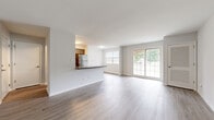 Located on Hannah Avenue in Norristown, PA, this one-bedroom, one-bathroom residence offers a well-designed single-floor layout that maximizes functionality and comfort. The open-concept kitchen and living area forms the heart of the home, where light hardwood-style flooring flows seamlessly throughout. The kitchen is equipped with stainless steel appliances, including a refrigerator and electric range, complemented by gray cabinetry, dark countertops, and a peninsula that provides additional workspace and casual seating. The living area is generously proportioned, bathed in natural light from large windows and a sliding glass door that opens to outdoor views, creating a bright and airy atmosphere. The spacious primary bedroom features plush wall-to-wall carpeting, a large window overlooking the surroundings, and a full-width closet with louvered bifold doors for ample storage. The full bathroom is clean and functional, offering a tub-shower combination with a white surround, hardwood-style flooring, and a vanity with a white countertop and brushed nickel fixtures. Two hallways connect the rooms efficiently, rounding out a practical and cohesive layout well-suited for comfortable everyday living.