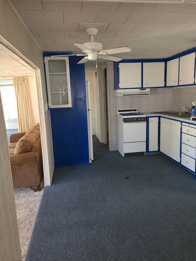 Building Photo - 55+ mobile home community. On canal to bea...