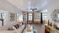 Located at 1111 North Mission Park Boulevard in Chandler, Arizona, this single-story 2-bedroom, 2-bathroom residence offers a thoughtfully designed layout across a comfortable footprint. The living room serves as the heart of the home, showcasing wood-style flooring, a ceiling fan with light kit, built-in shelving, and multiple windows that flood the space with natural light. Neutral wall tones and clean lines create an inviting ambiance throughout.

The kitchen is well-equipped with white cabinetry, granite-style countertops, stainless steel appliances including a range, microwave, dishwasher, and refrigerator, complemented by a window above the sink. An adjacent dining area features a corner window arrangement, offering pleasant outdoor views and an airy atmosphere.

The primary bedroom is a generous retreat with a ceiling fan and carpeted flooring, while the second bedroom also includes a ceiling fan and sliding glass door access. Both bathrooms are finished with white vanities, large mirrors, and wood-style flooring, with one bathroom featuring a walk-in shower. A hallway connects the rooms efficiently, completing the functional and cohesive floor plan of this Chandler residence.
