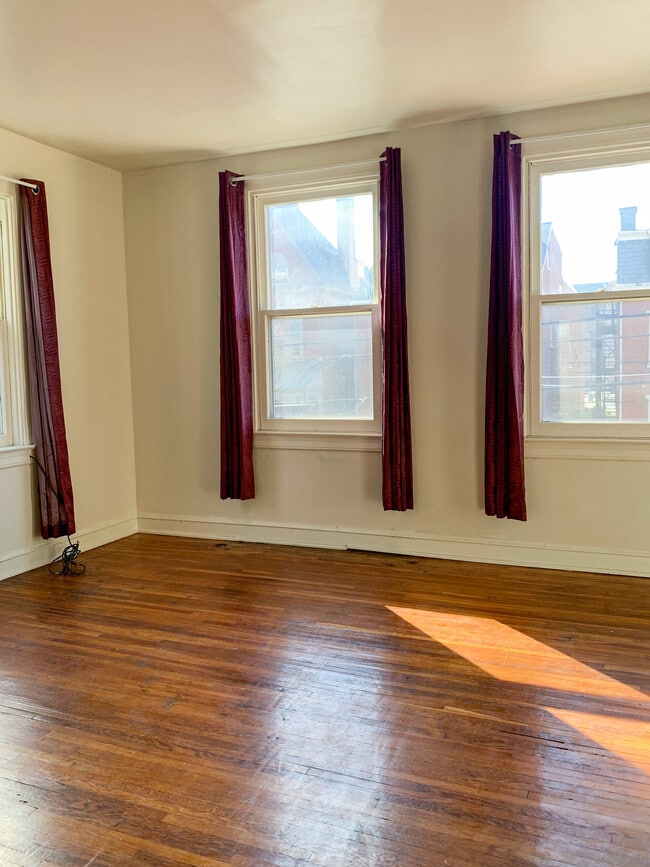 View of bedroom, windows looking out onto Duke Street. - 325 N Duke St