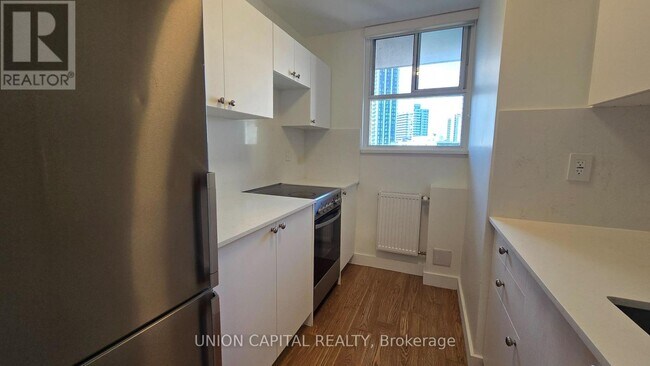 Photo du bâtiment - 407-230-1230 Oak St