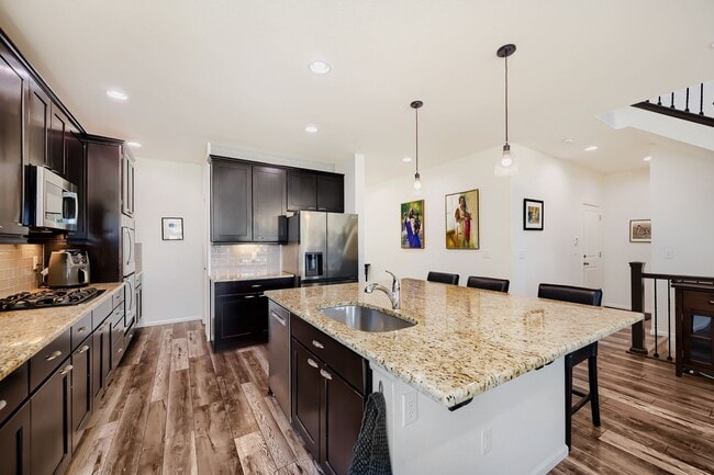 Building Photo - Stunning & Contemporary 4-Bedroom Home on Open Space-Available July 1st!