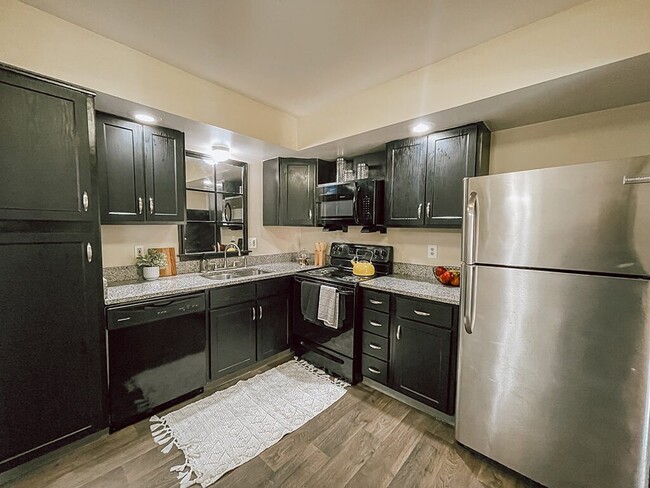 Kitchen with Granite Countertops - The Preserve at Woodland