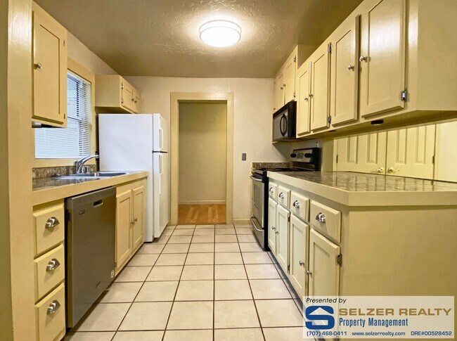Building Photo - Charming 2 bd. bungalow set against the we...