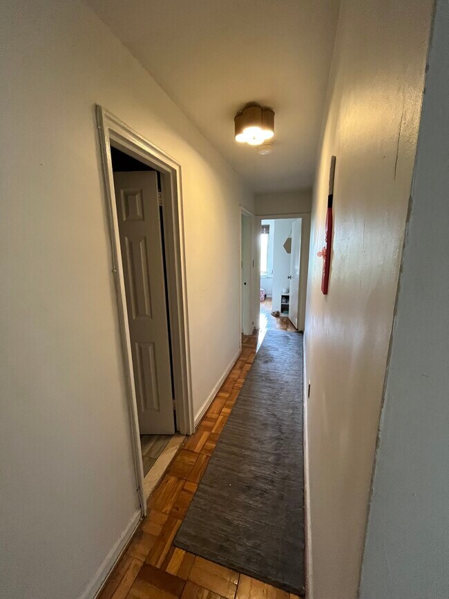 Hall to secondary bath, bedrooms 1 and 2 - 4301 Massachusetts Ave NW