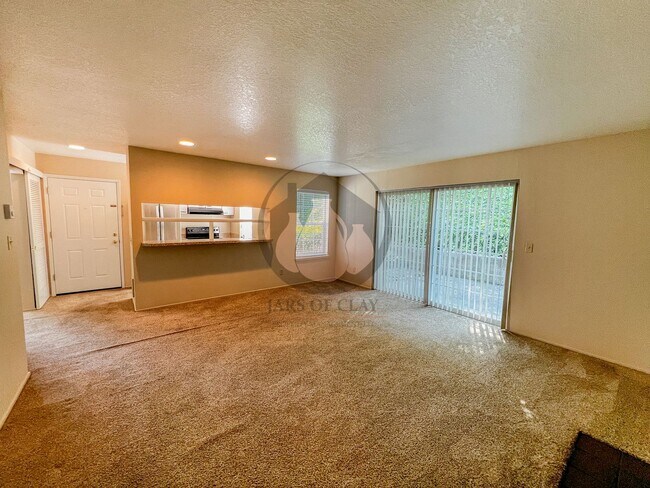 Building Photo - Adorable Ground Level Charbonneau Condo - ...