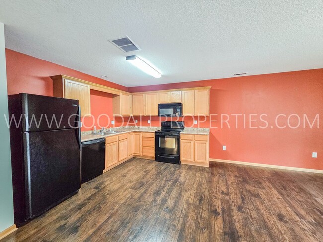 Building Photo - Bright & Spacious Waukee Townhome Near Dining, Shopping & Entertainment and attached 2-car garage