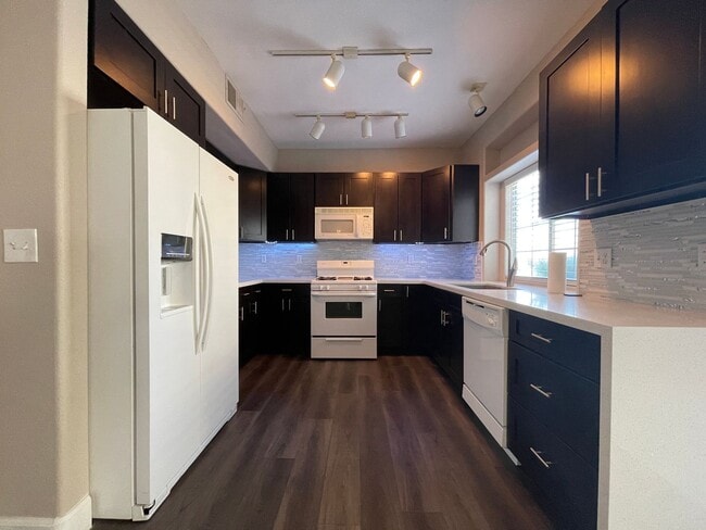 Building Photo - Beautifully remodeled first floor condo with attached 2 car garage!