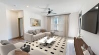 This contemporary 1020 square foot apartment offers a thoughtfully designed living space with two bedrooms and two bathrooms. The open-concept layout seamlessly integrates the kitchen, living, and dining areas, creating a spacious and inviting atmosphere. The kitchen boasts modern appliances, light-colored cabinetry, and a central island with seating, perfect for casual dining or entertaining.

The primary bedroom, measuring 150 square feet, provides ample space and features a large window for natural light. Both bedrooms are well-appointed with plush carpeting and generous closet space. The bathrooms showcase modern fixtures, sleek vanities, and stylish tile work.

Throughout the apartment, a neutral color palette with warm wood tones creates a cohesive and calming ambiance. The living area is adorned with a striking geometric rug and contemporary furnishings, while ceiling fans and recessed lighting add both function and style. Large windows in the main living spaces offer abundant natural light and city views.

Attention to detail is evident in the thoughtful design elements, such as the built-in storage solutions and carefully curated artwork. The apartment's layout maximizes space efficiency while maintaining a sense of openness and flow, making it an ideal urban retreat.